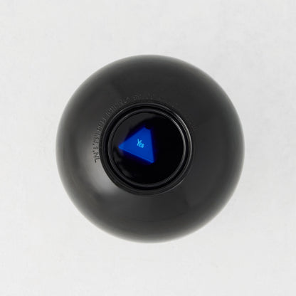 4.5-inch black Magic 8-Ball toy with a blue triangular window displaying the word Yes on a white background.