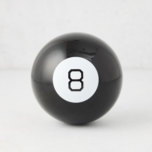 Classic 4.5-inch black Magic 8-Ball toy with a white circular window and black number eight on a white background.