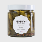 Maison Marc Cornichons Fins in a clear glass jar with a white lid and label, showing green pickles and spices.