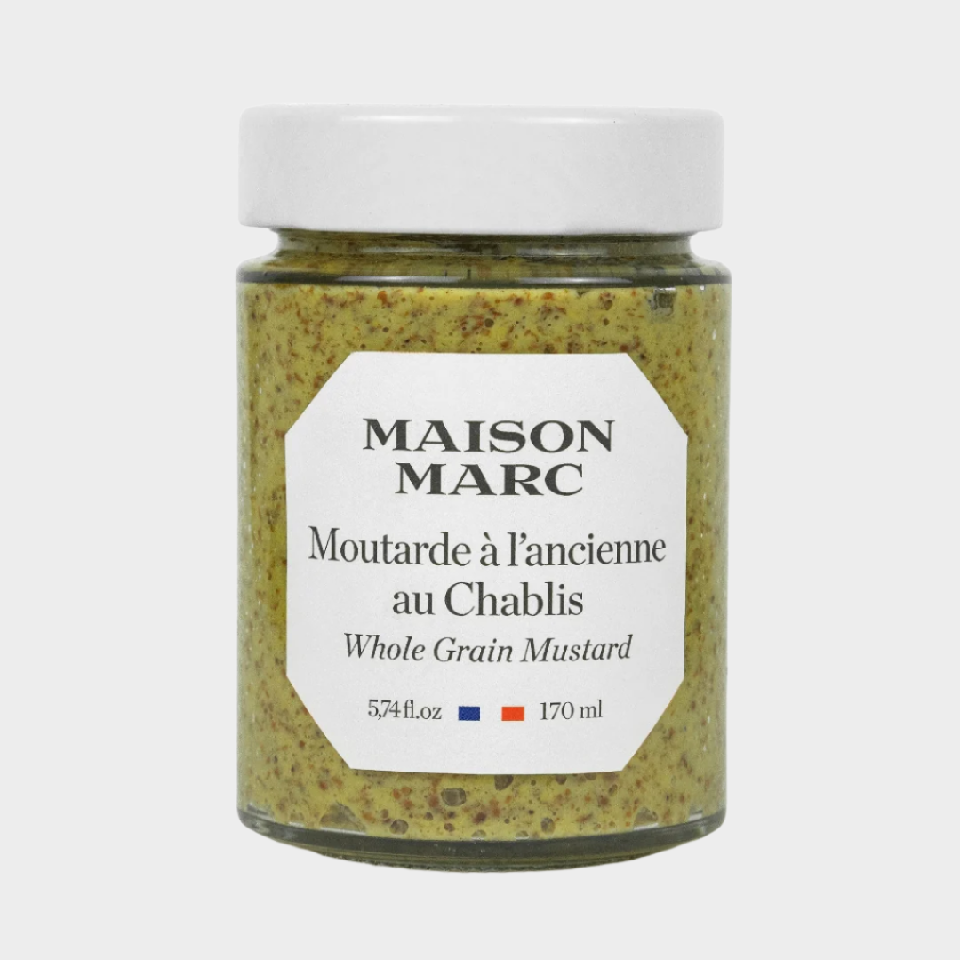 Maison Marc Whole Grain Mustard in a clear glass jar with a white lid and label.