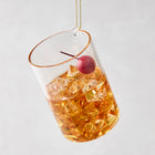 3.25-inch glass Manhattan cocktail Christmas ornament with amber liquid, ice cubes, and a red cherry garnish.