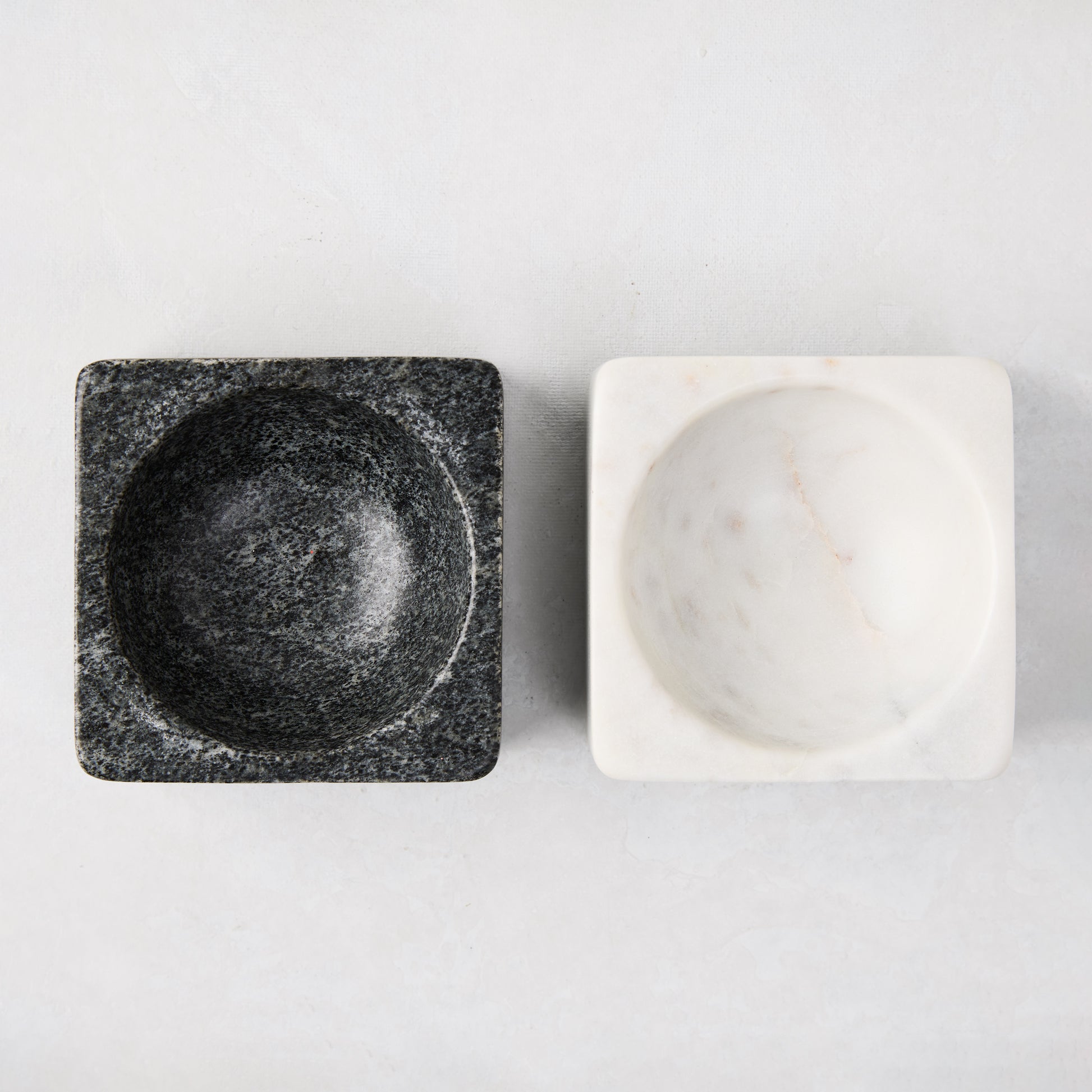 Black and white marble square pinch bowls, 3" square, with round interiors.