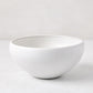 Matte white stoneware bowl with subtle grey speckles, handcrafted in Portugal.