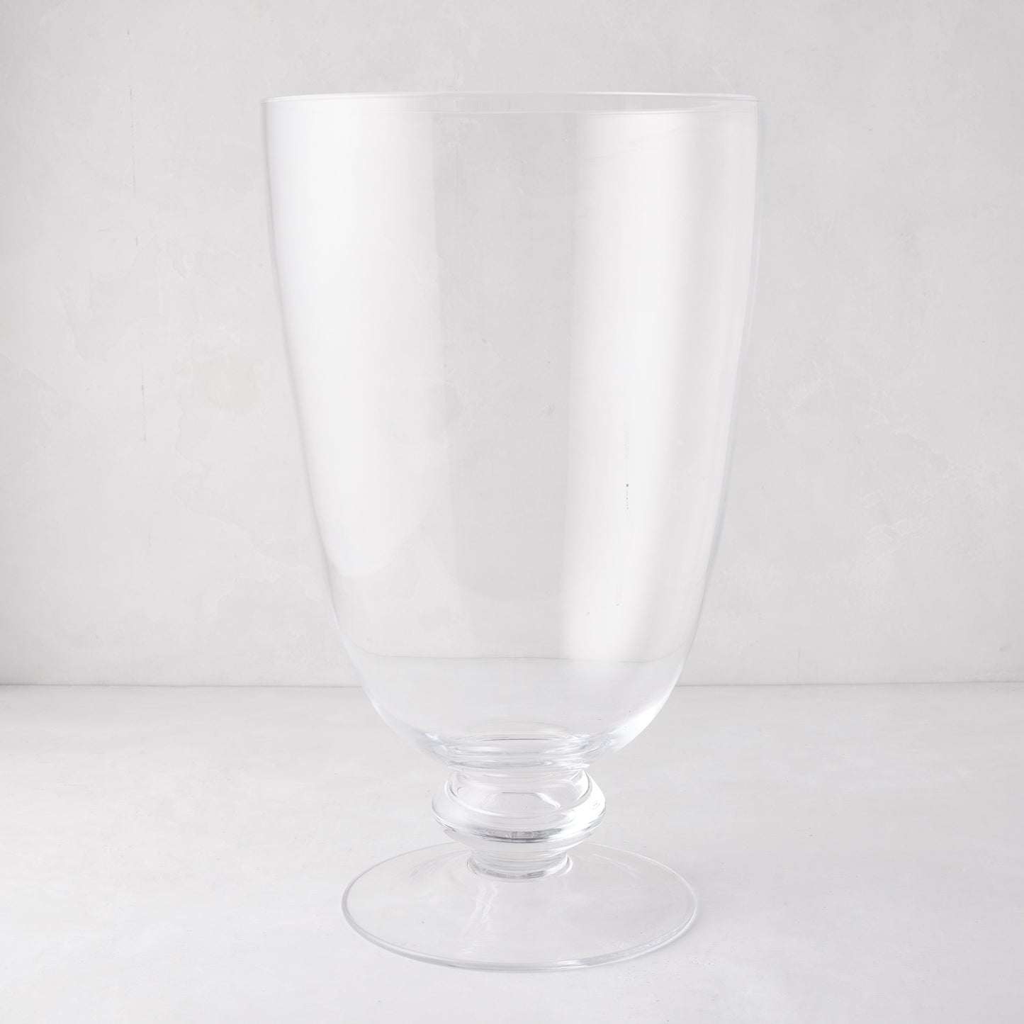 Large Mayfair clear glass hurricane with clean lines and decorative base.