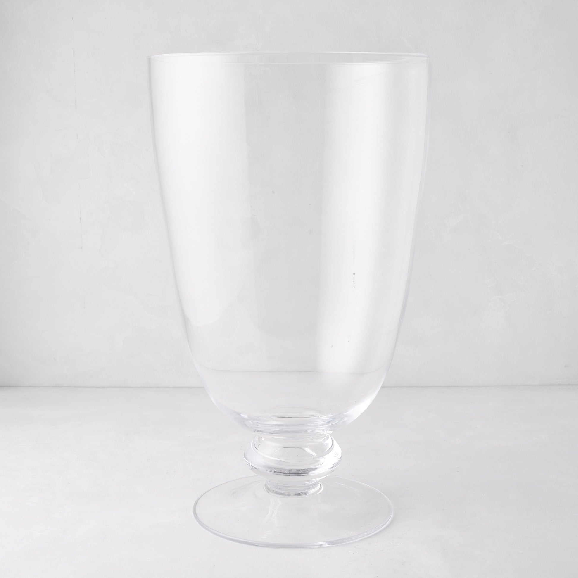 Large Mayfair clear glass hurricane with clean lines and decorative base.