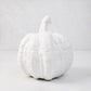 Small matte white ceramic pumpkin, 8.5"H x 9"W, with ribbed texture and short stem.