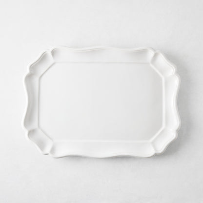 Medium 14-inch white ceramic Torcello serve platter with a scalloped edge, made in Italy.