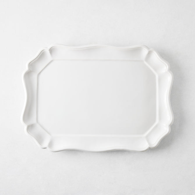 Medium 14-inch white ceramic Torcello serve platter with a scalloped edge, made in Italy.