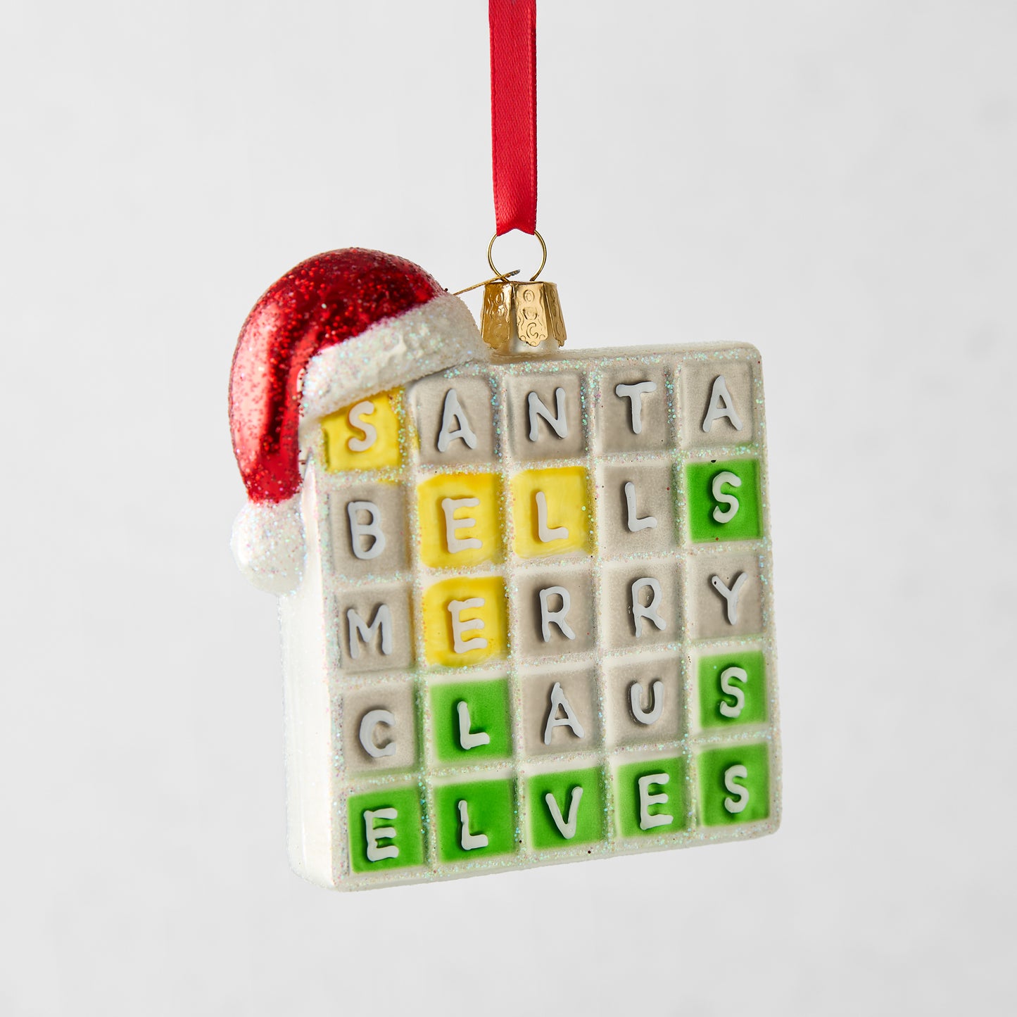 Merry Words Christmas tree ornament, a white glass square with colorful letter tiles and a red glitter Santa hat.