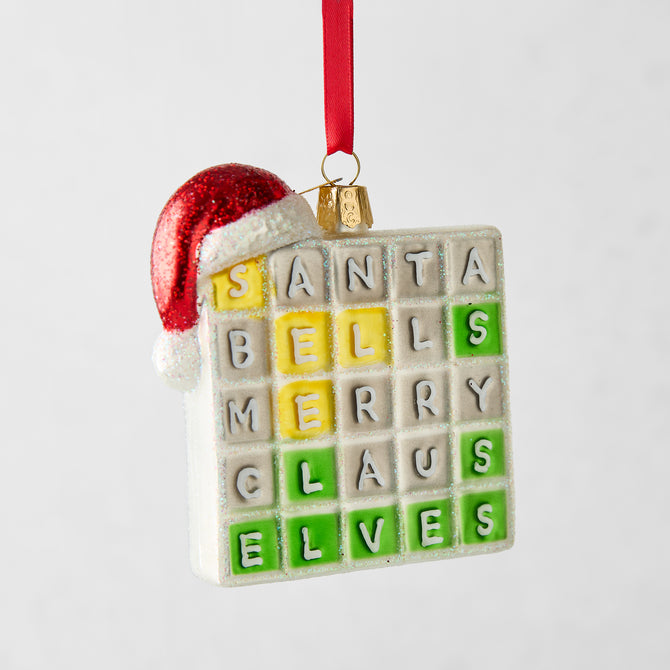 Merry Words Christmas tree ornament, a white glass square with colorful letter tiles and a red glitter Santa hat.