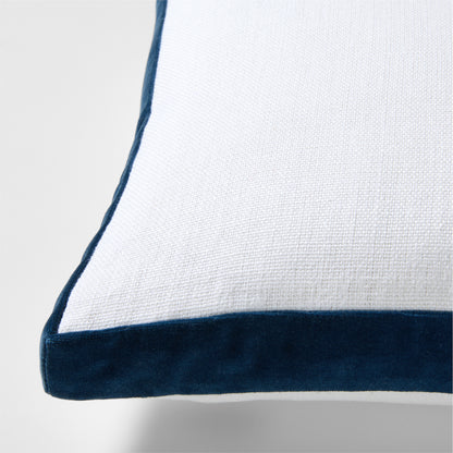 White linen lumbar pillow with midnight blue velvet gusset trim.