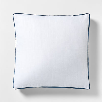 White linen square pillow with midnight blue velvet gusset and piping.
