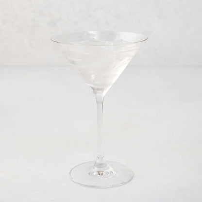 Clear glass Midtown Martini Glass, 8.5"H, filled with ice and a clear drink.
