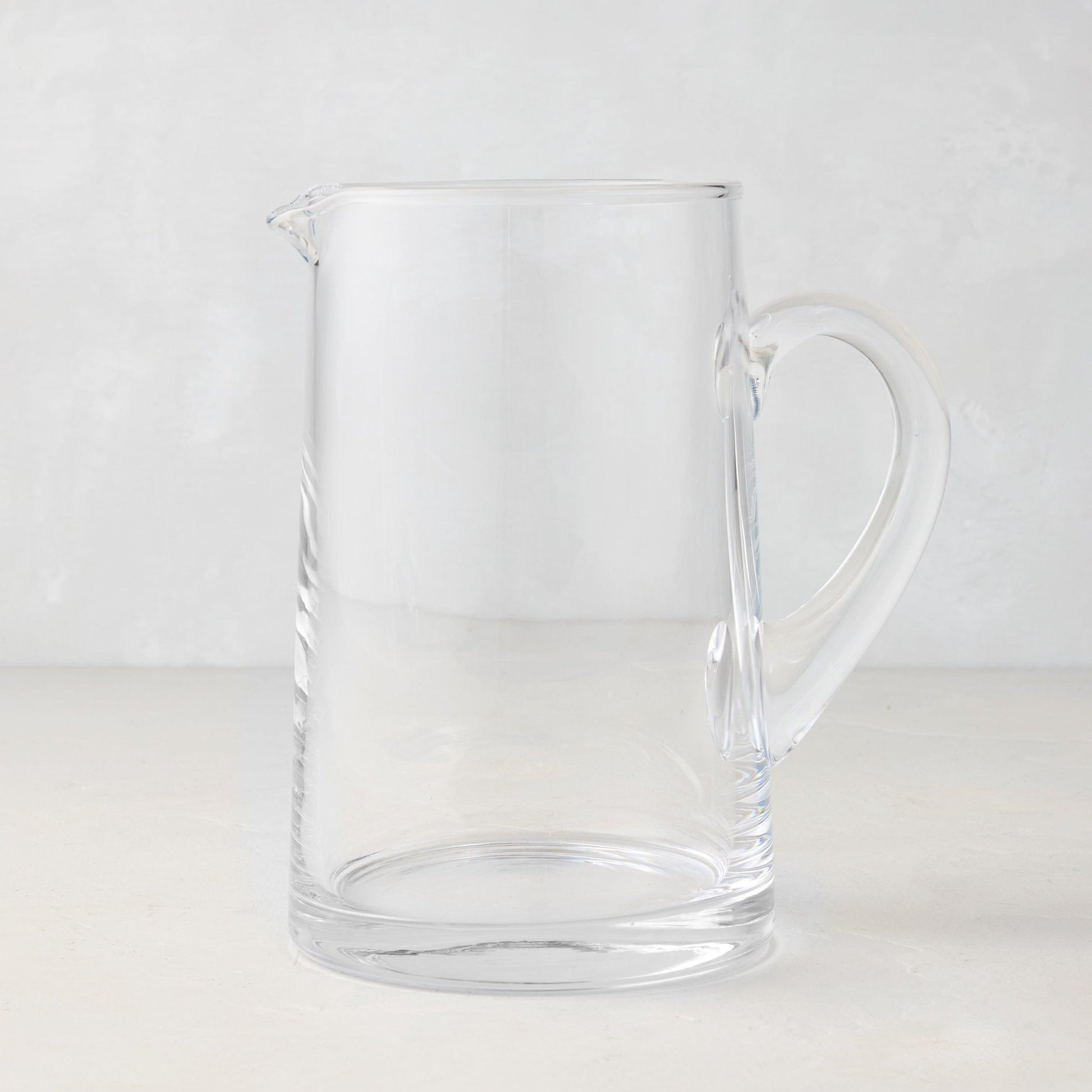 Midtown Tapered Glass Pitcher, clear, sleek design, with a handle and pour spout.