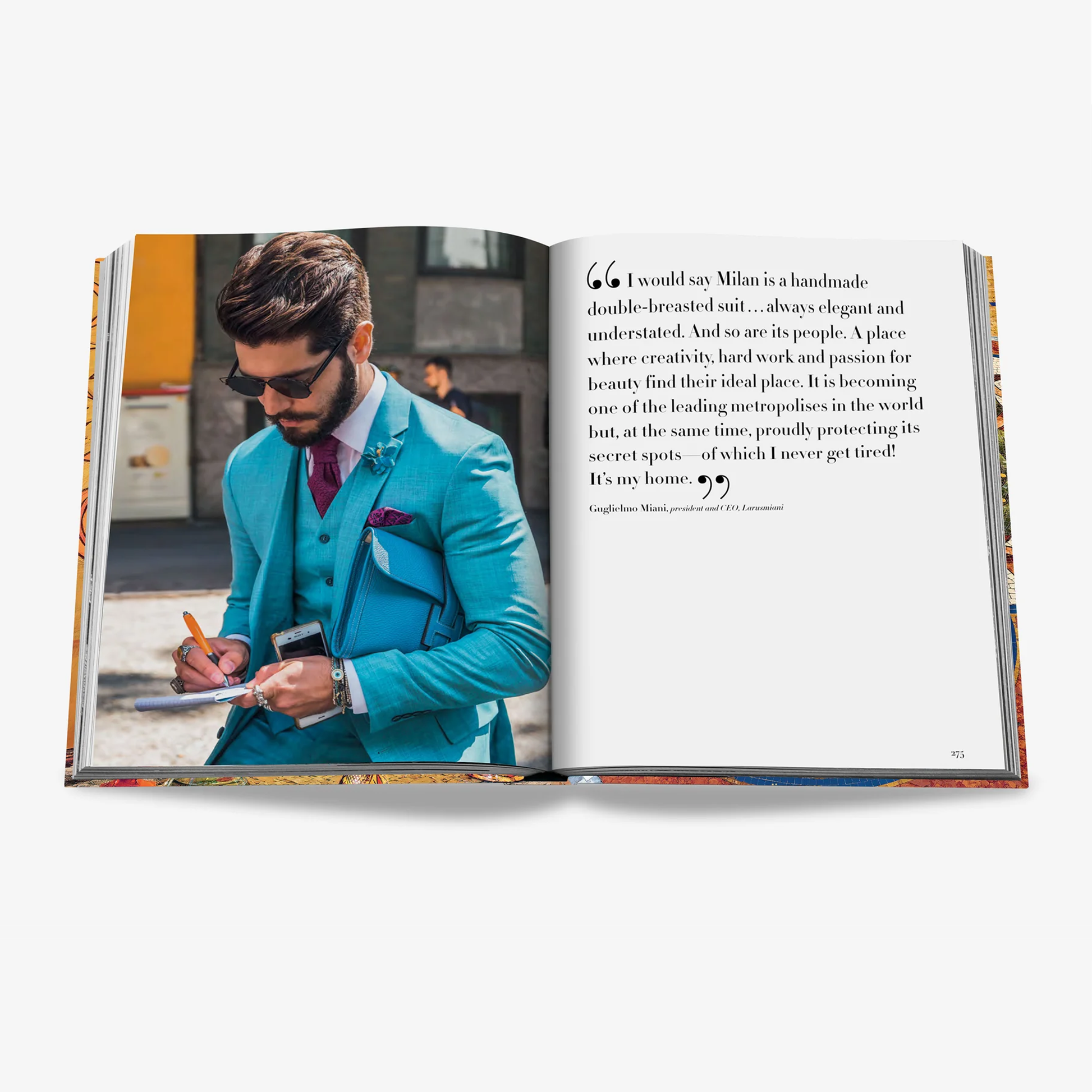 Open "Milan Chic" book showing a man in a turquoise suit and a quote about Milan.