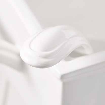 Close-up of a white ceramic Milano soup tureen handle, showing its elegant curved design.