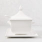 Milano white ceramic soup tureen with lid, handles, and serving spoon on a rectangular tray.