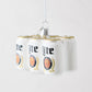 Hand-painted glass Miller Lite six-pack beer can ornament with glitter accents and a silver hanging loop.