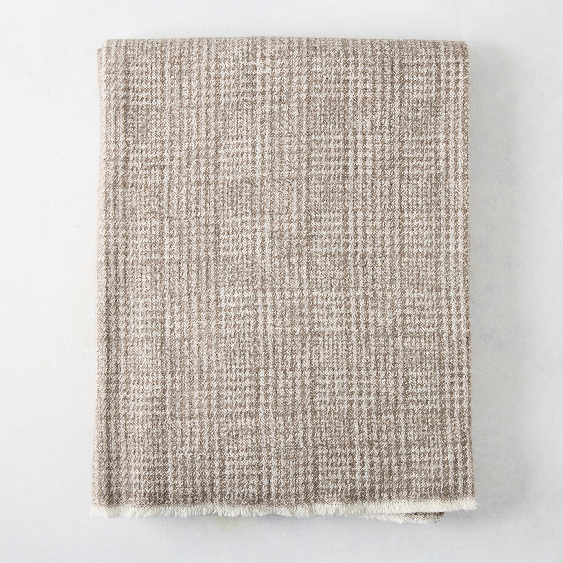 Mink brown Sutton Houndstooth throw blanket, 51"W x 67"L, cotton-acrylic blend with raw edge.