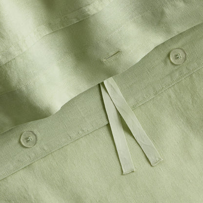 Mint green European washed linen duvet cover with button closures and fabric ties in a soft, textured finish.