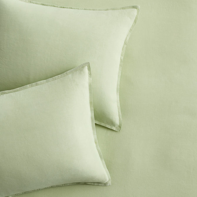Set of two mint green European washed linen euro shams with a soft, textured finish and flange border detail.