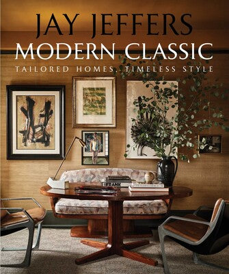 Modern Classic book cover featuring a sophisticated interior with a wooden table, patterned settee, and gallery wall.