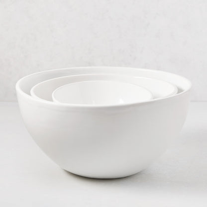 Three nested HG Modern white ceramic serve bowls, medium to small.