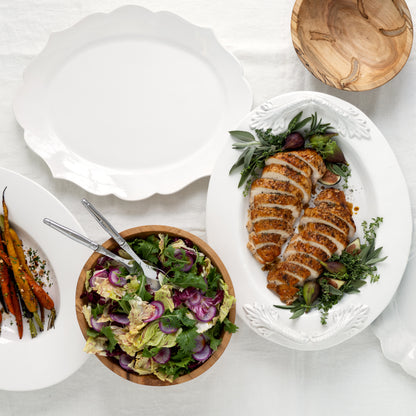 Modern Oval Wide-Rim Large Ceramic Platter, creamy white stoneware, 21"L x 16.5"W, with scalloped edges.