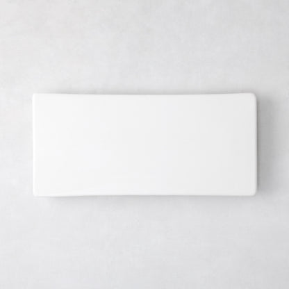 Modern rectangular white ceramic serving platter, 14.75"L x 6.75"W, with clean lines and low profile.