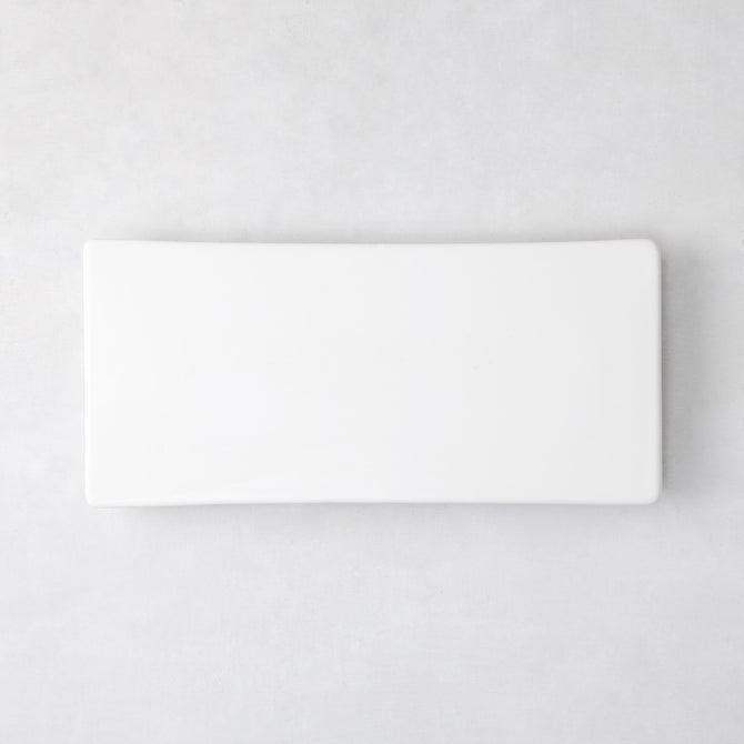 Modern rectangular white ceramic serving platter, 14.75"L x 6.75"W, with clean lines and low profile.