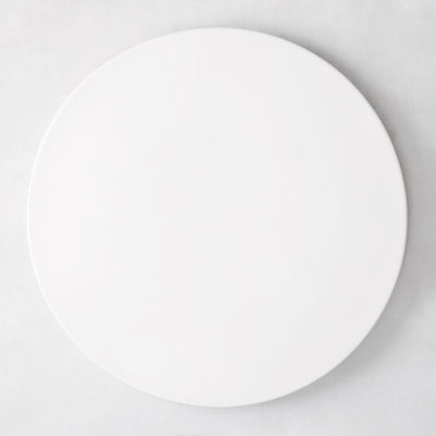 Modern round white ceramic serving platter, 14.5" diameter, smooth edgeless surface.