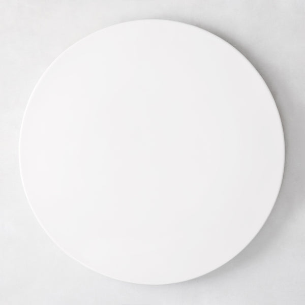 Modern round white ceramic serving platter, 14.5" diameter, smooth edgeless surface.