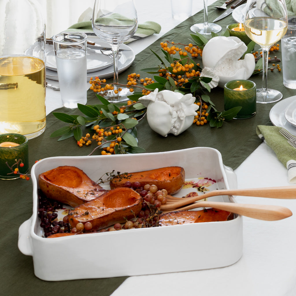 Handmade creamy white ceramic rectangular baking dish by Montes Doggett, filled with roasted squash.