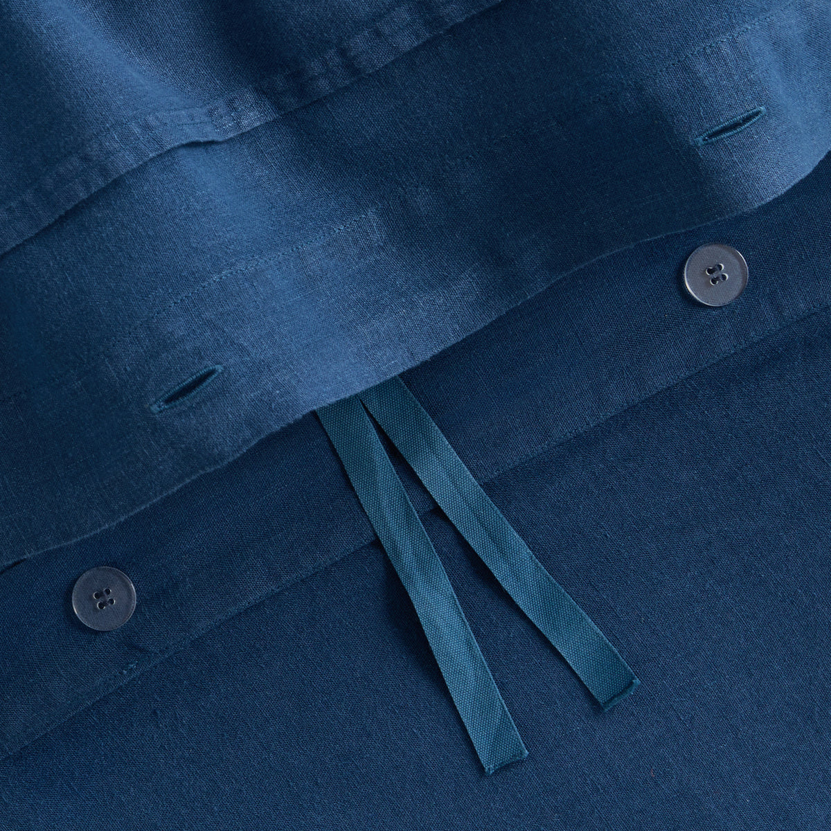 Moonlight blue washed linen duvet cover with button closures and fabric ties from the Hudson Grace collection.