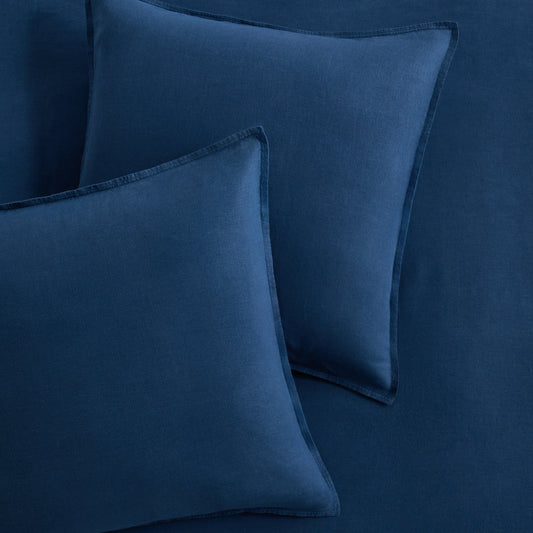 Set of two square Moonlight Blue European washed linen euro shams with flange edges.