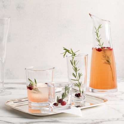 Clear Mozes Scissor-Cut Water Glass, 10.5 oz, with a rippled rim, alongside other drinkware.