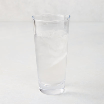 Mozes Scissor-Cut Water Glass, clear air-blown glass, 10.5 oz, with a rippled rim, filled with ice water.
