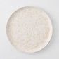 Natural Nuno Splatter 8.25" stoneware salad plate with pale cream base and beige splatter.