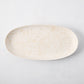 Natural Nuno Splatter Stoneware Serving Platter, pale cream with beige splatter design, 17"L x 8.25"W.