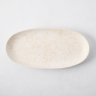 Natural Nuno Splatter Stoneware Serving Platter, pale cream with beige splatter design, 17"L x 8.25"W.