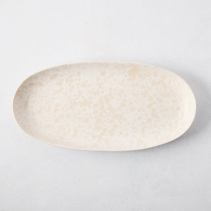 Natural Nuno Splatter Stoneware Serving Platter, pale cream with beige splatter design, 17"L x 8.25"W.