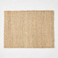 Rectangular natural woven abaca placemat in a honey-brown hue, 19"L x 14"W.