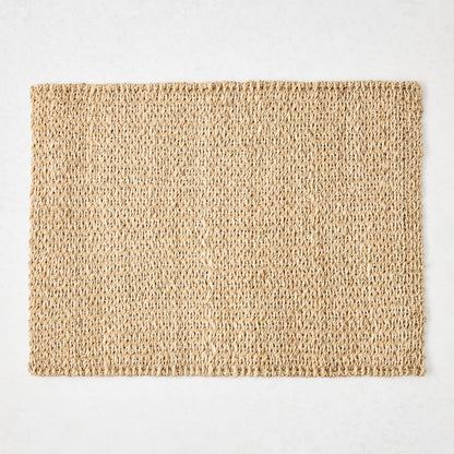 Rectangular natural woven abaca placemat in a honey-brown hue, 19"L x 14"W.