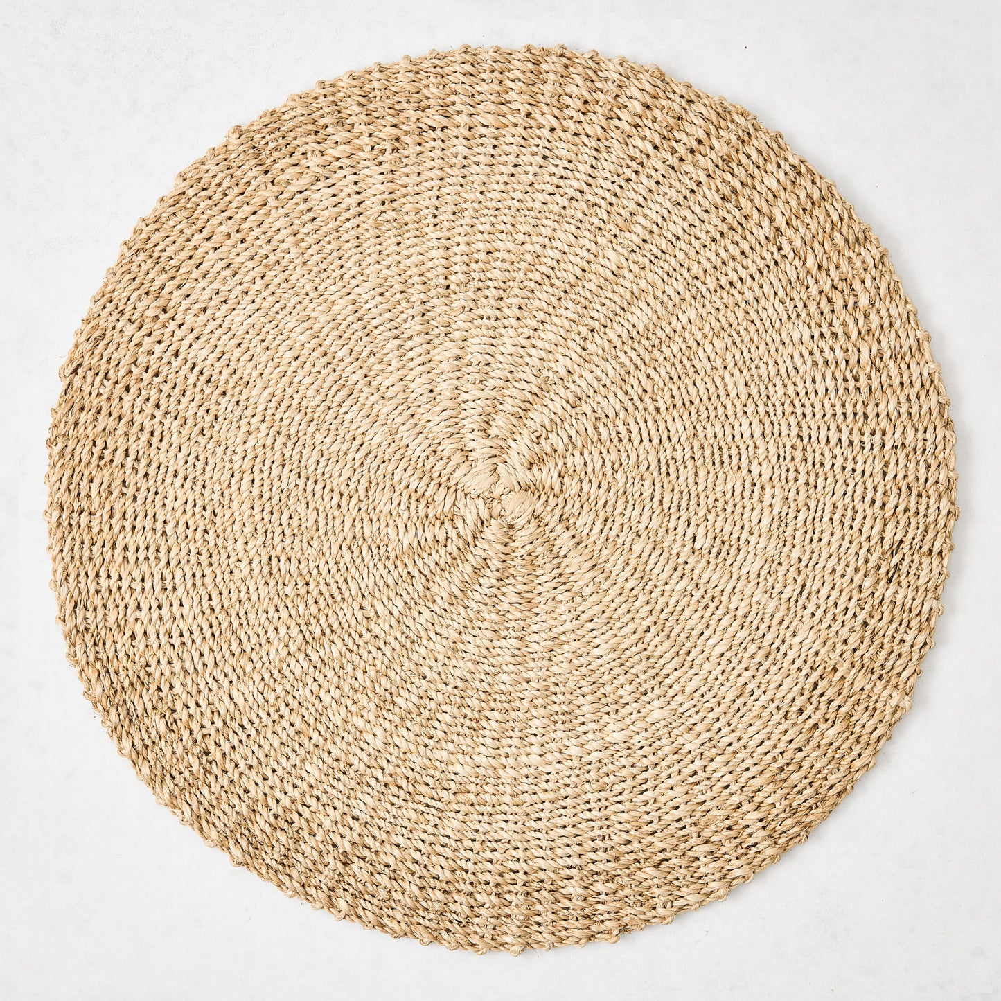 Hudson Grace natural woven round abaca placemat, 16"Dia, honey-brown hue.