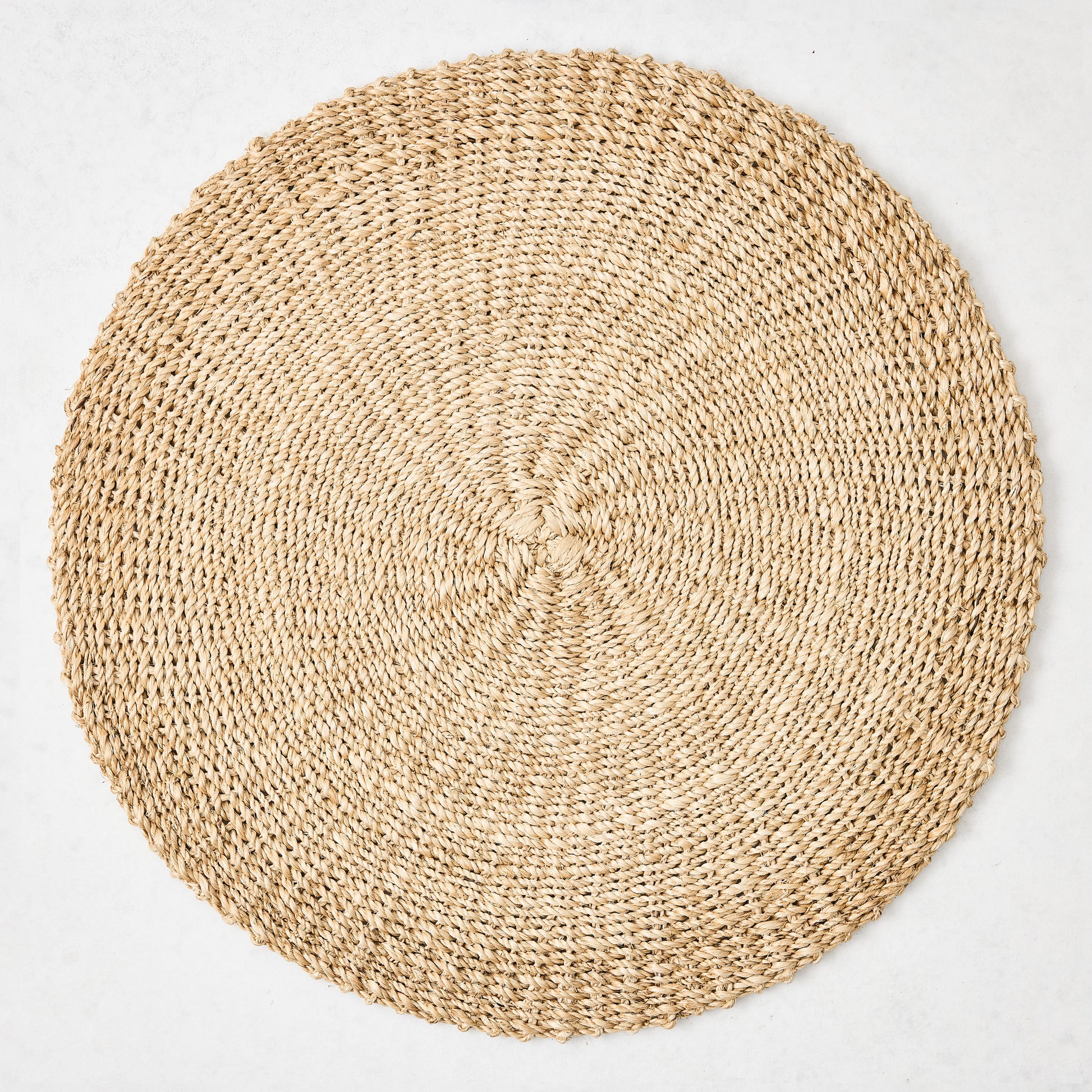 Hudson Grace natural woven round abaca placemat, 16"Dia, honey-brown hue.