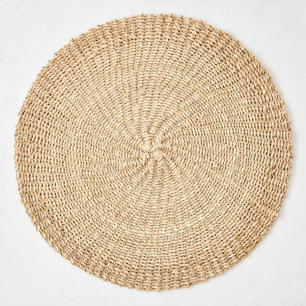 Hudson Grace natural woven round abaca placemat, 16"Dia, honey-brown hue.