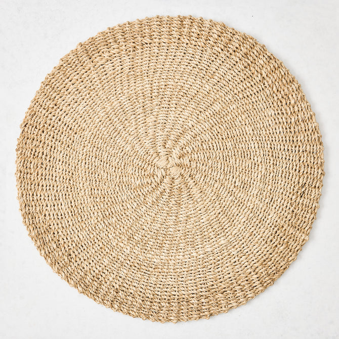 Hudson Grace natural woven round abaca placemat, 16"Dia, honey-brown hue.