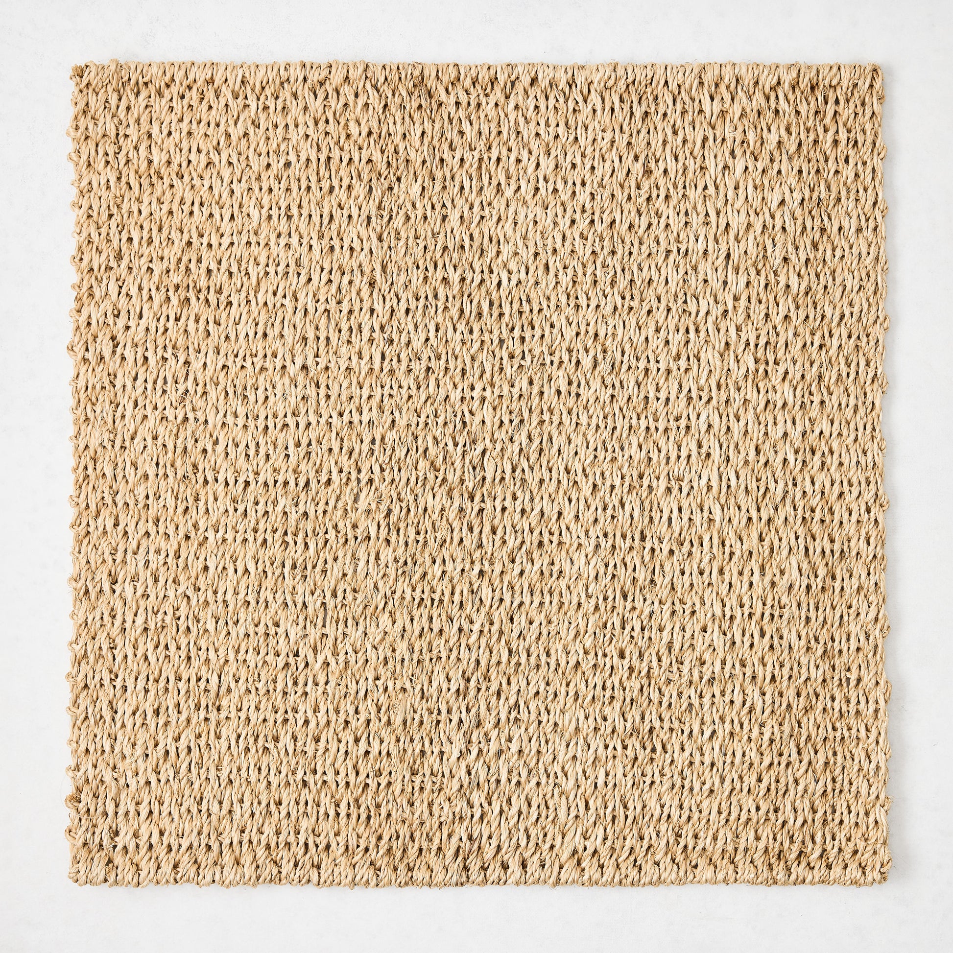 Natural Woven Square Placemat, 16" honey-brown abaca, handcrafted texture.