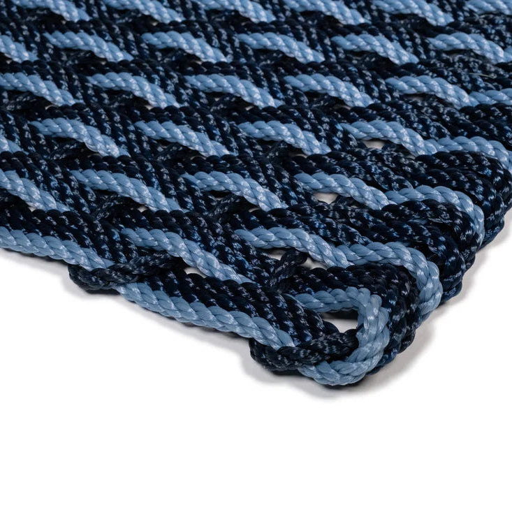 Navy and Glacier Bay braided rope doormat, handwoven with durable, all-weather rope.