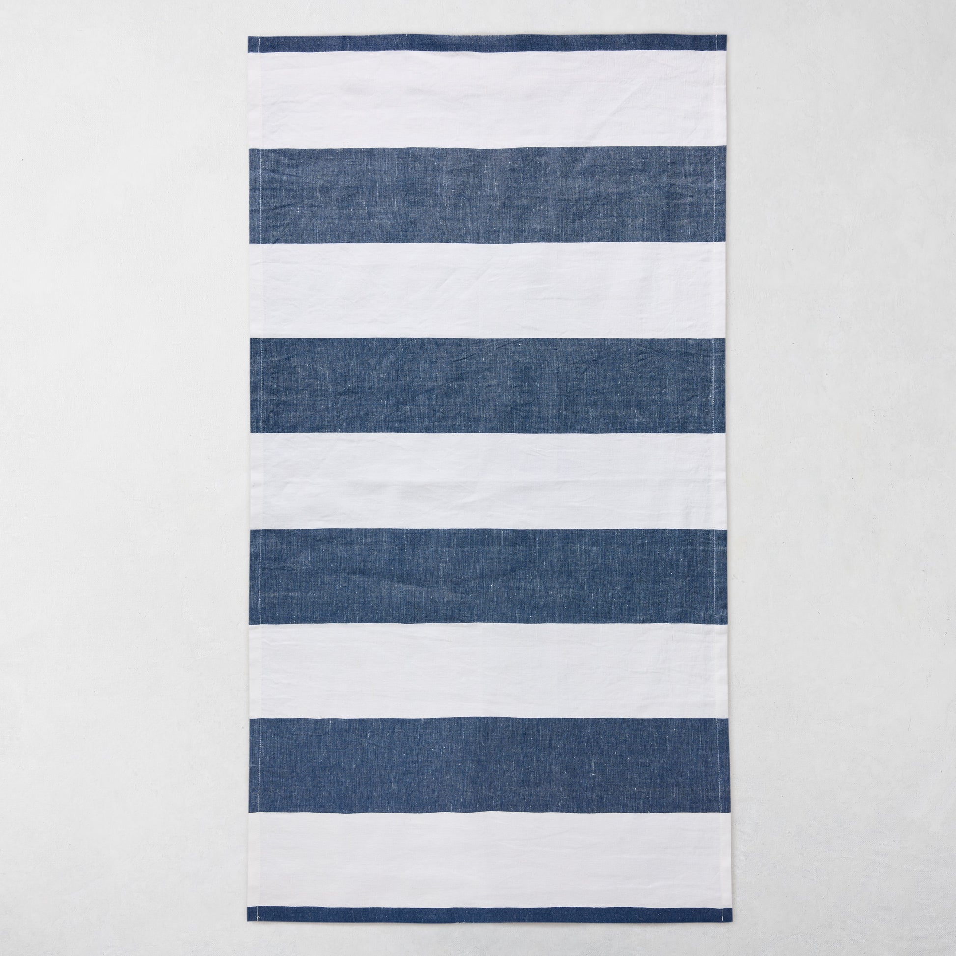 Navy and white striped cotton-linen hand towel, 20"W x 30"L.